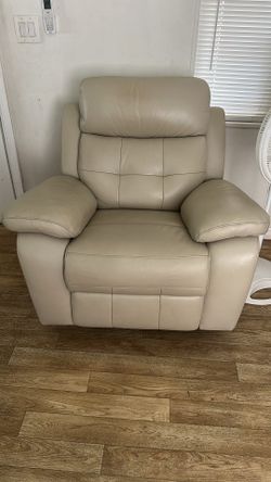 Beige Leather Chair and red sofa .