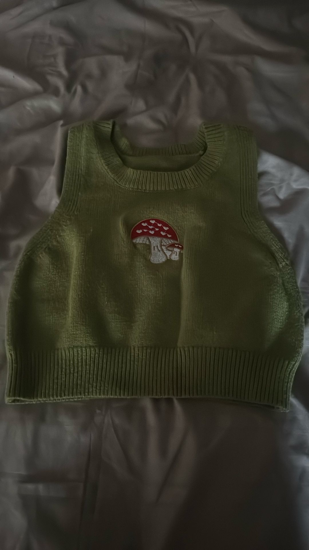 green mushroom vest