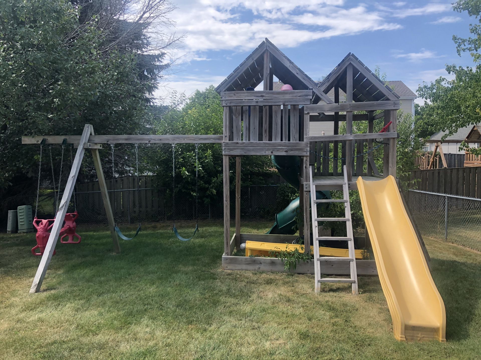 Custom swing set, 2 slides, climbing wall, and water slide!