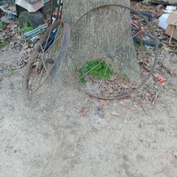 Two Antique Metal Wagon Wheels