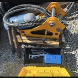 Mini excavator jackhammer attachment