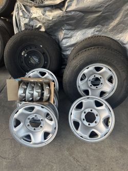 Hankook Dynapro HT Tires and Toyota Tacoma OEM Steel Wheels with Center Caps