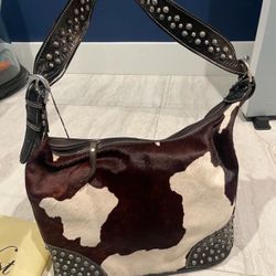 Designer bag/purse by American West  Brown and white cowboy slouch hobo bag. Never used.  Still in original bag/Case