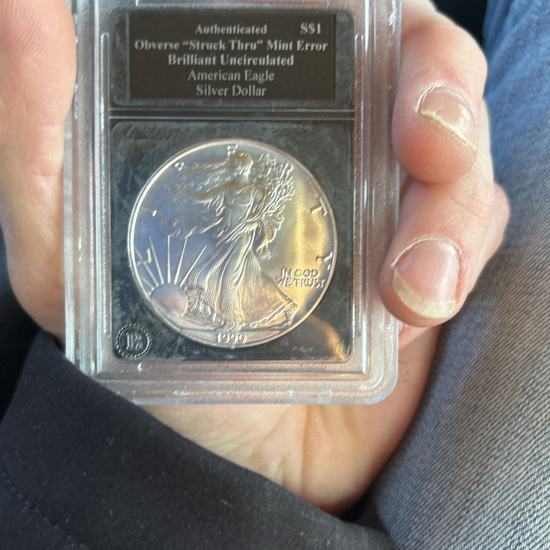 1990 Silver American Eagle Strike Through No Mint Mark