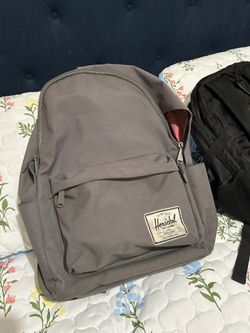 Herschel grey backpack with red/white stripe interior