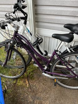 Two women’s bikes, 3 helmets