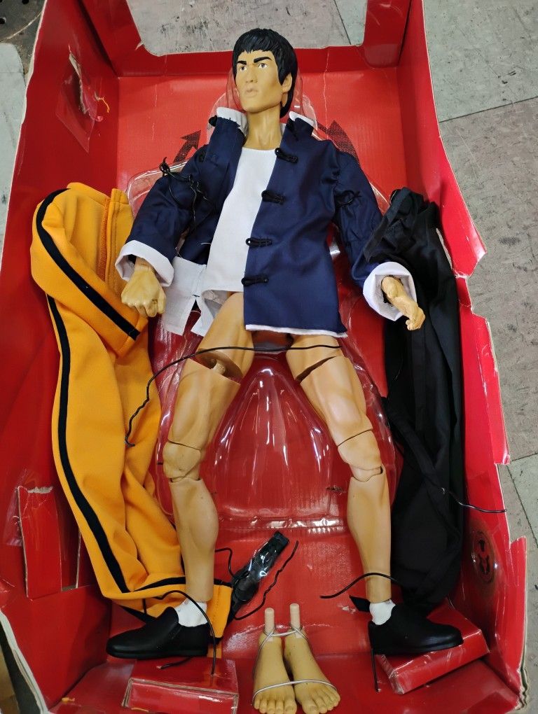 Bruce Lee Asylum Ultimate Series action figure, specifically the 18-inch Collector Edition from 2001 by Art Asylum His legs broke off at the thigh can