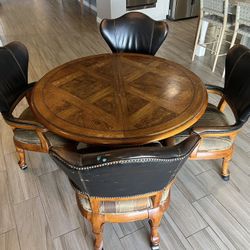 Ornate Heavy Table with Four Rolling Chairs