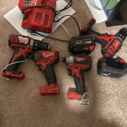 Milwaukee Drills , Batteries , And Charger 