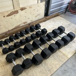 New pair of 15,20,25,30,45,50,55 and 60lb rubber dumbbells NEW IN BOX $600