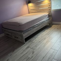 Queen size bed with nightstand and lights