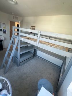 Full size loft bed with desk and storage in great condition!