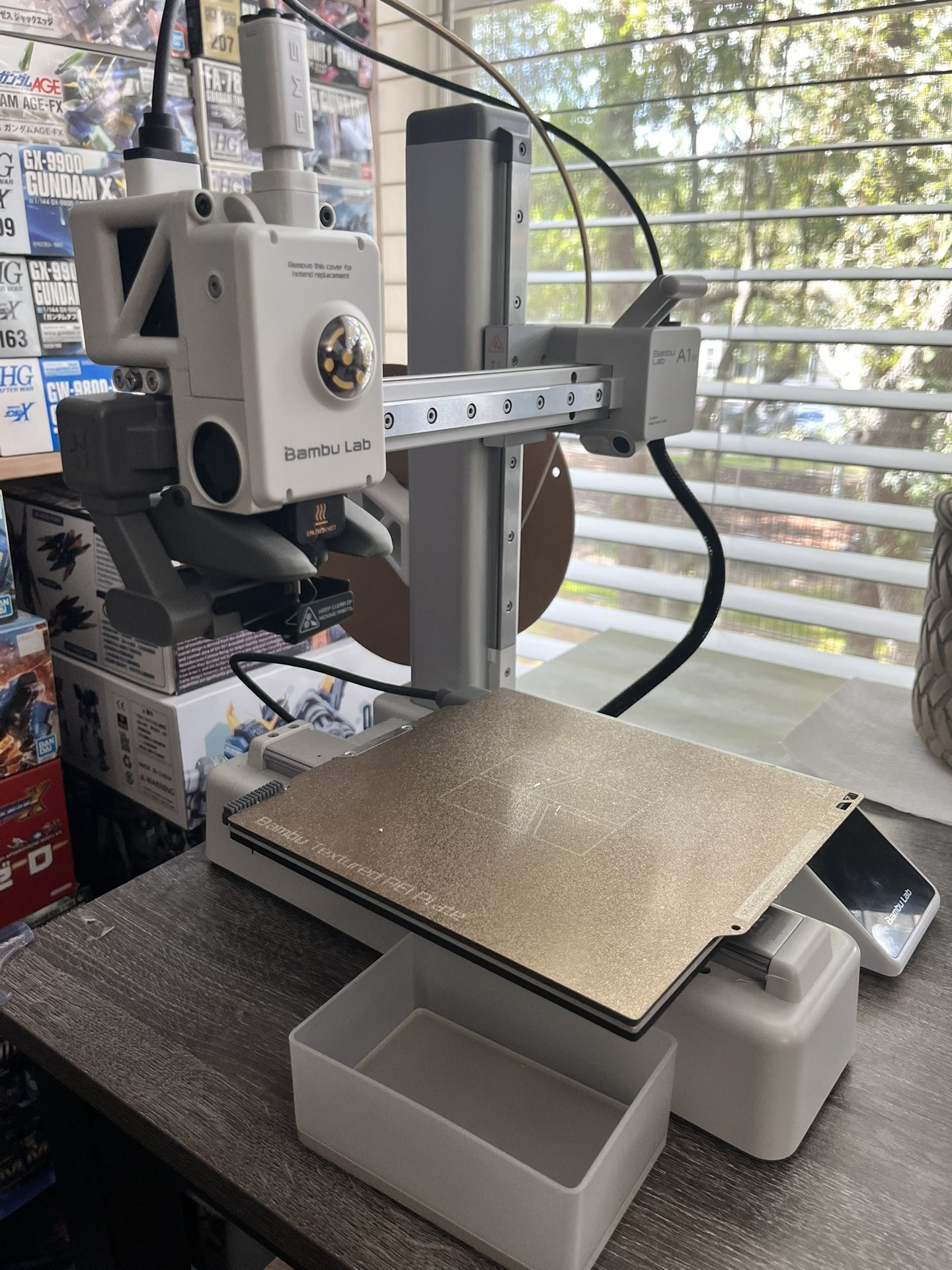 Bambu Lab A1 Mini with extra filament.