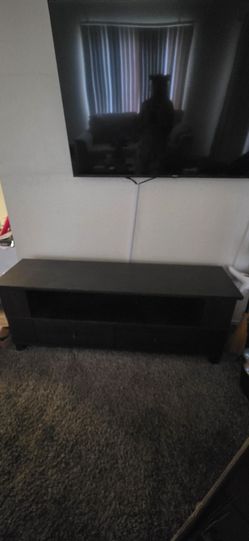 Brown Tv stand with 2 drawers