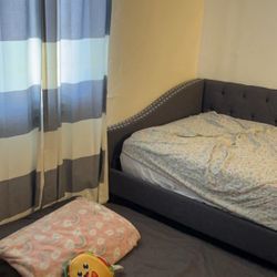 Grey upholstered Trundle Bed