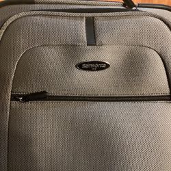 Samsonite Carry On Luggage.( Grey) Dimensions are: 14”W —10”D — 20”H