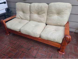 Real wood sofa with cushions in good condition