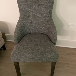 Grey chair with brown legs