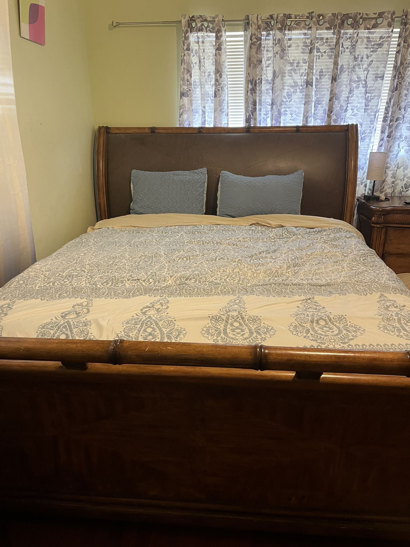 King size bed frame with large dresser with large mirror and side dresser as well