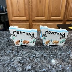 Ceramic Montana  State Pair of Salt And Pepper Shakers.  Preowned.  Has been on display in a cabinet with a very large salt and pepper shakers collect