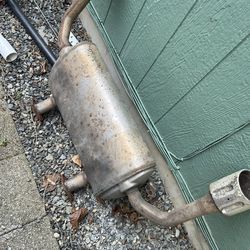 used OEM Nissan rear exhaust muffler manufactured by Calsonic Kansei, for a Nissan Altima, Rogue, or Infiniti Q50 mode