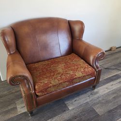 A Pair Of Oversize Wing Back Chairs & Ottoman