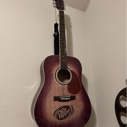Sunburst acoustic guitar branded by Dr Pepper