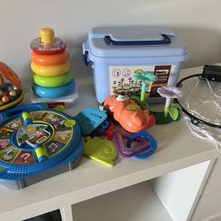 Toys, stuffed animals, car mirror, and blanket blankets