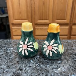 Vintage Small Hand Painted pair of Salt and Pepper Shakers. Size approximately 3 1/2 inches tall. Preowned.