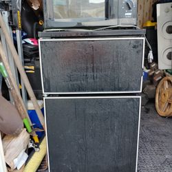 Refrigerator With Microwave Attached To The Top I Believe It Came Out Of A Trailer Camping Trailer