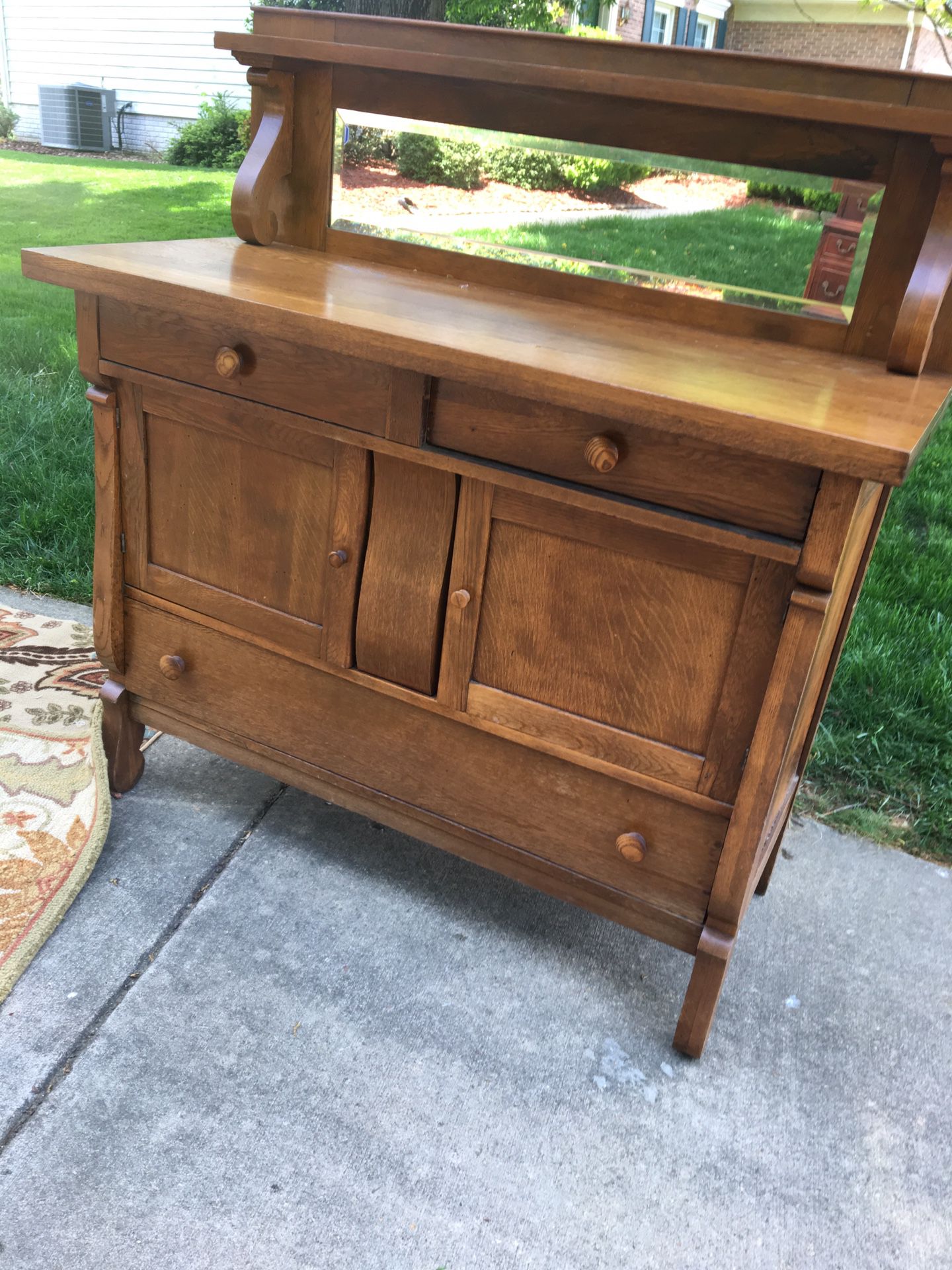 Antique buffet/sideboard with beveled glass mirror