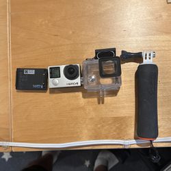 GoPro hero 4 With Case, Extended Battery, Handle, and 4GB microSD