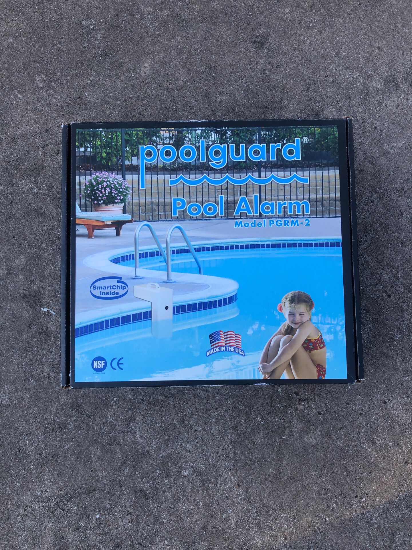 Pool alarm in box and never been used.