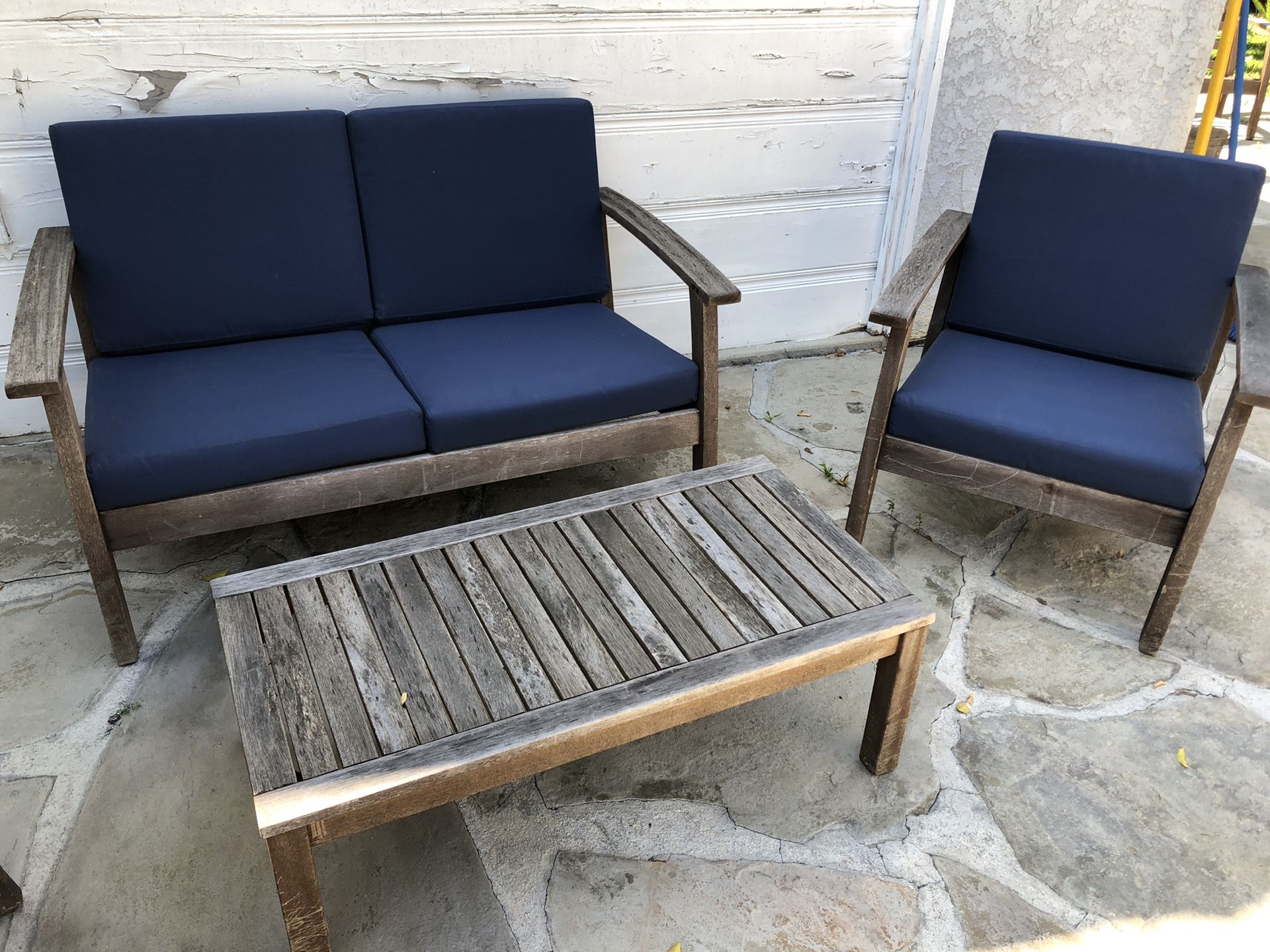 Pottery barn teak patio furniture set with matching cushions and cushion storage bin