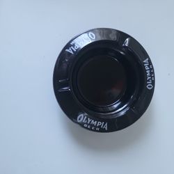 Vintage olympia beer black glass ashtray