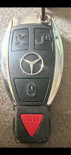 Mercedes-Benz 4-button smart key fob with a distinctive chrome and matte black