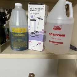 Nail supply’s acetone immersion jar and barbicide