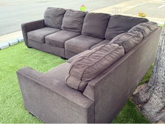 Two-piece dark gray L-shaped sofa