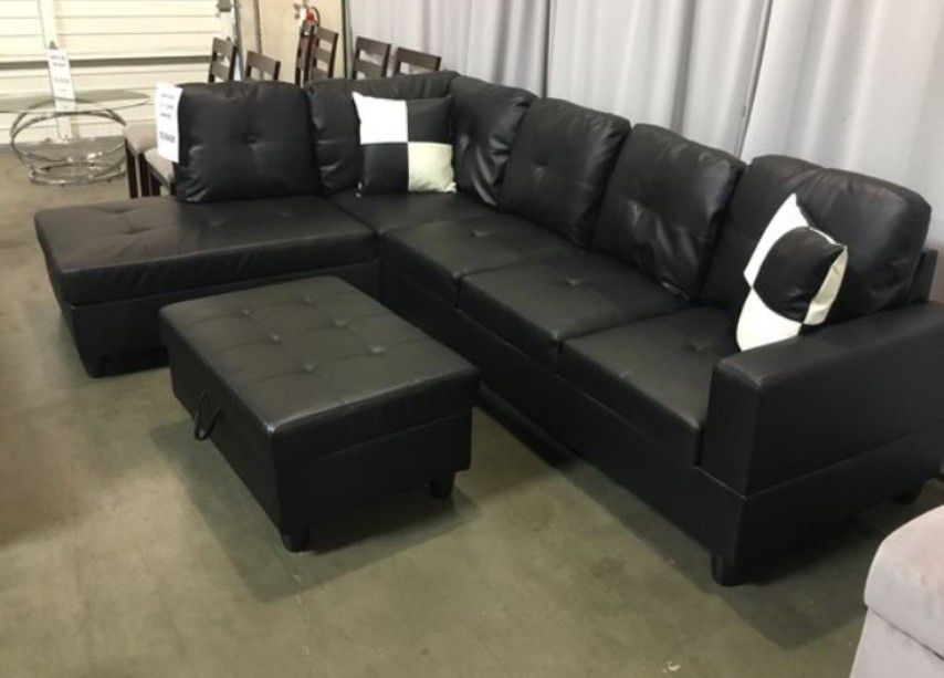 Brand New Black Leather Sectional Set With Decorative Pillows & Storage Ottoman