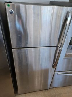 GE Stainless steel Garage style top freezer refrigerator Open Sundays