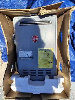 This is a Rheem outdoor natural gas tankless water heater,  the RTG-70XLN-1 model,