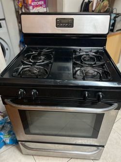 Two items for sale, a Frigidaire stove and a 36 inch Kenmore refrigerator
