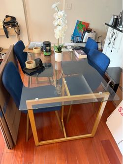 Glass dining room table and chairs