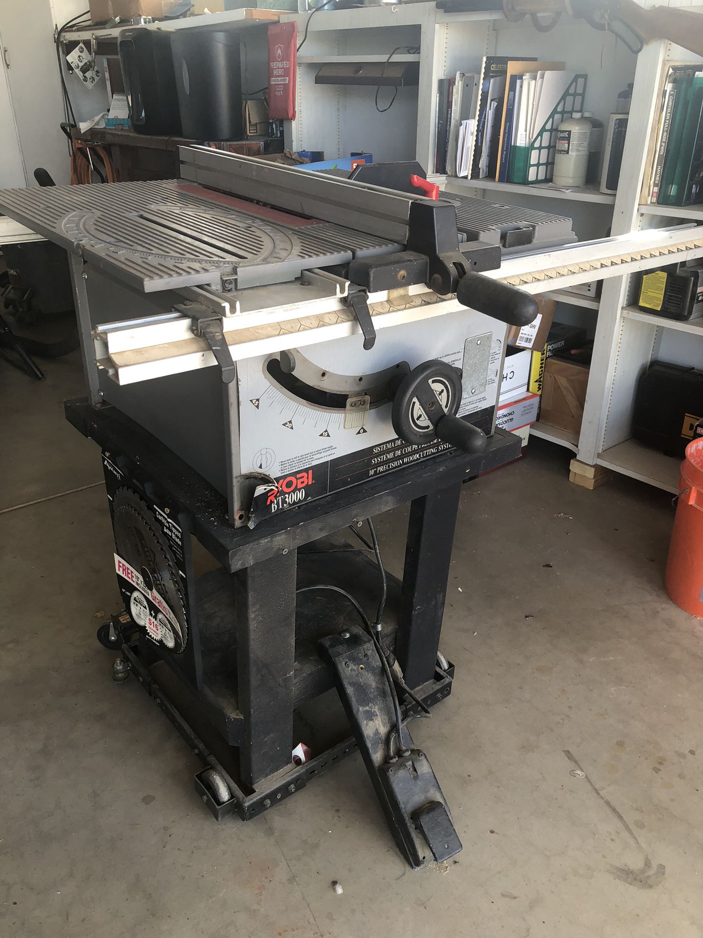 Ryobi Table Saw It’s Mounted On A Rolling Table With Locking Wheels