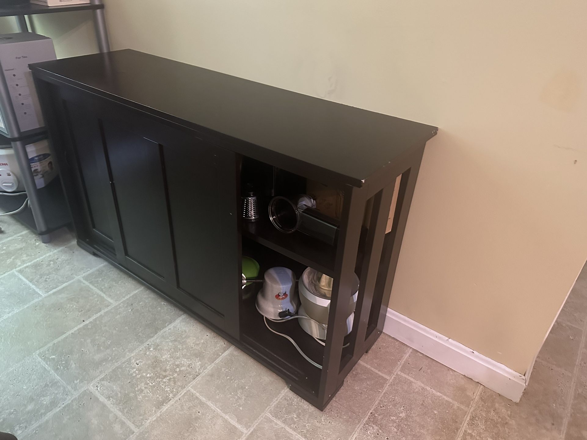 Black Wooden Credenza With Shelves Having Sliding Doors