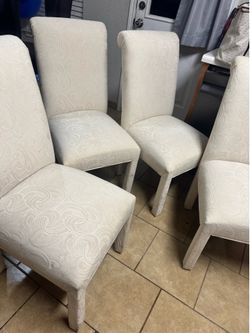 4 white chairs