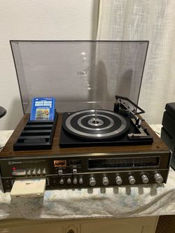 Vintage Emerson stereo Radio Record player and 8 Track with Not the original speakers . Everything works fine