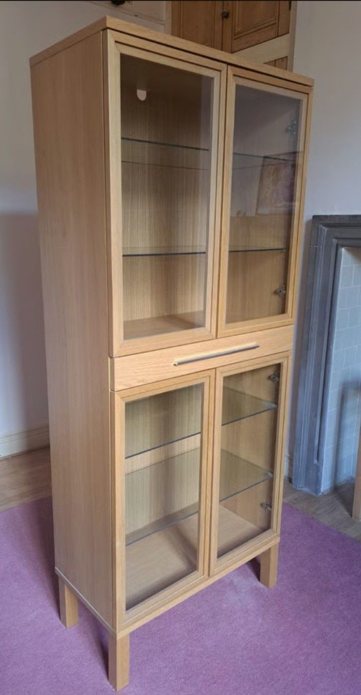 Beautiful 4 door glass display cabinet. Like new!!