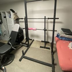 Squat Rack With Barbell and Weights 
