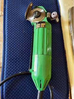 "Consew" electric fabric cutter.